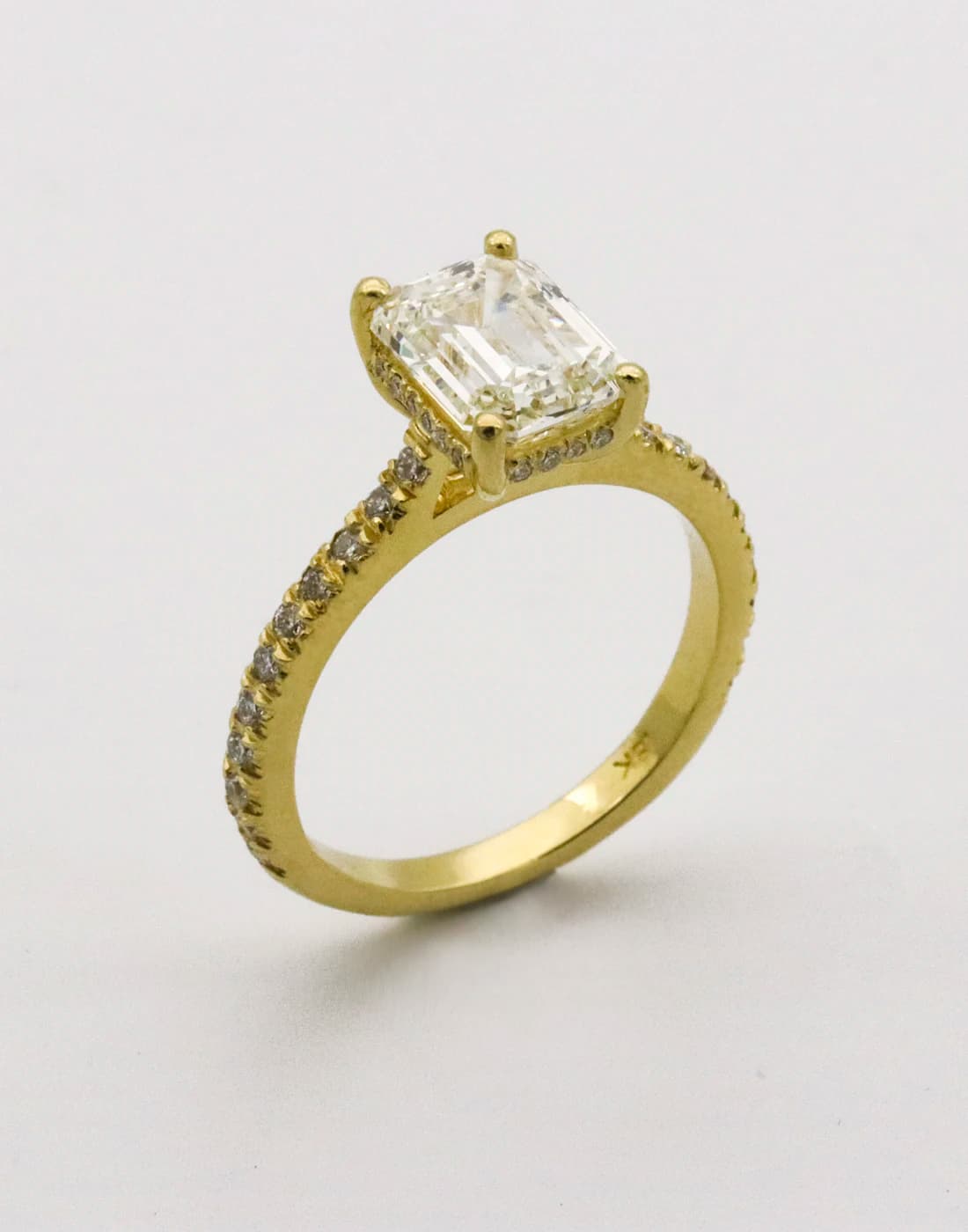 Hands setting a lab-grown diamond